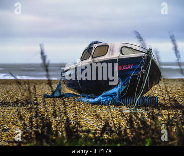 Boat left abandoned on beach, photographed with a Mamiya Rb67 film camera and some Fuji Velvia 50 120 film Stock Photo