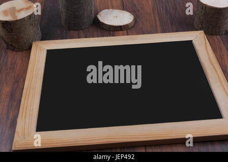 Сhalk board frame on wooden table Stock Photo