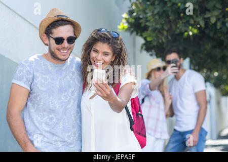 Hip couple taking selfie Stock Photo