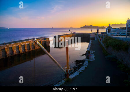 Plymouth waterfront harbour with drakes island in background, golden sunset, Plymouth, Devon, UK, England Stock Photo