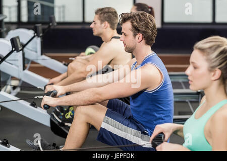 Fit people on drawing machine Stock Photo