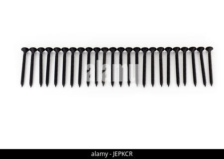 Black drywall screws isolated on white Stock Photo - Alamy