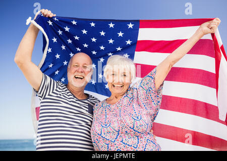 Senior couple holding american flag Stock Photo