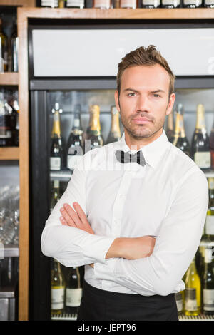 Handsome barman crossing his arms Stock Photo