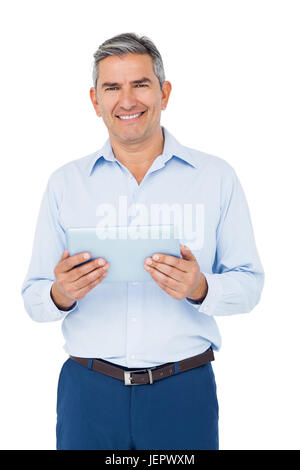 Smiling businessman using tablet Stock Photo