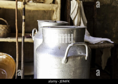 Antique metal containers for milk, detail of objects on a farm Stock Photo