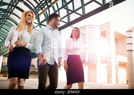 Picture of young attractive business partners standing outdoor Stock Photo