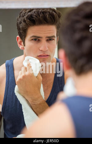 Man wiping his face with napkin Stock Photo