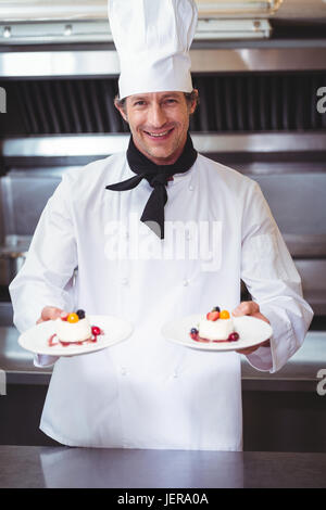 Chef holding his dish Stock Photo