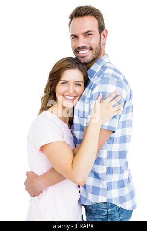Happy young couple cuddling each other Stock Photo