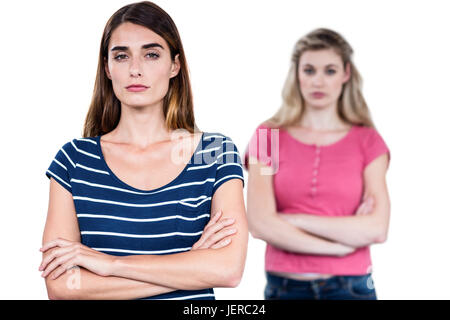 Portrait of upset friends with arms crossed Stock Photo