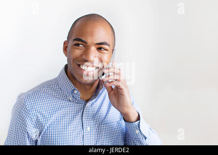 Young man using cell phone Stock Photo