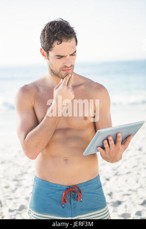 Smiling man using tablet Stock Photo