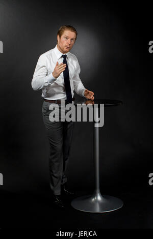 Businessman having presentation, studio shot Stock Photo