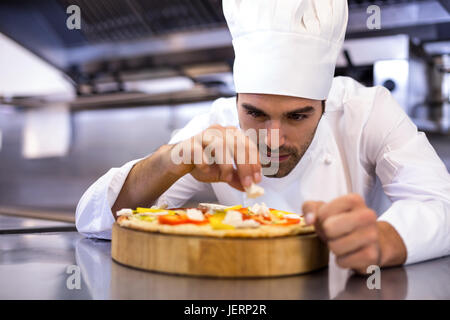 Pizza chef making pizza Stock Photo