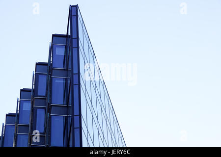 Perspective and underside angle view to textured background of contemporary glass building skyscrapers . Stock Photo