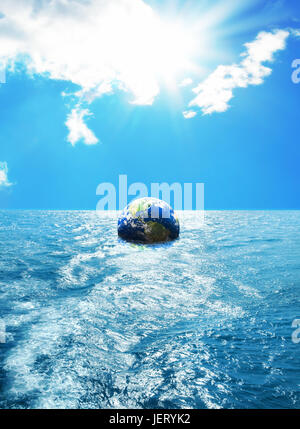Globe floating on sea over sunny background. Furnished NASA globe image used. Stock Photo