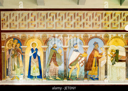 The holy three kings bring their gifts to the Christchild. Romanesque fresco in Jelling church, Denmark - Sept 13, 2014 Stock Photo