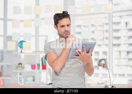 Man holding digital tablet and sticky notes Stock Photo