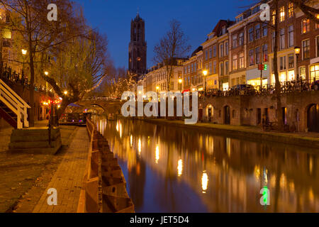 The Oudegracht canal and Dom church in Utrecht in The Netherlands at night. Stock Photo