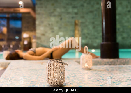Europe, Italy, Helvetia Thermal SPA Hotel Porretta Terme  woman resting by the pool and lantern Stock Photo