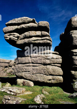 Detail of one of the granite outcrops on Combestone Tor, Dartmoor, showing deep horizontal creases and a vertical cleft in the solidified magma. Stock Photo