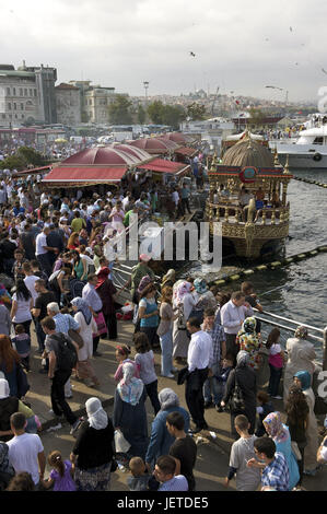 Turkey, Istanbul, part of town of Eminou, person before the fish restaurants in the Golden Horn, Stock Photo