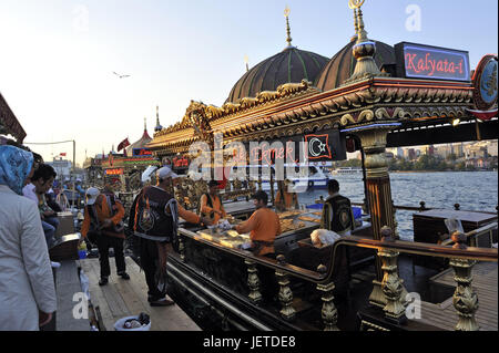 Turkey, Istanbul, part of town of Eminou, person before the fish restaurants in the Golden Horn, Stock Photo