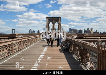 walking over the brooklyn bridge New York City USA