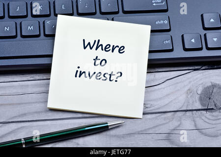 Question Where to invest on notes closeup Stock Photo