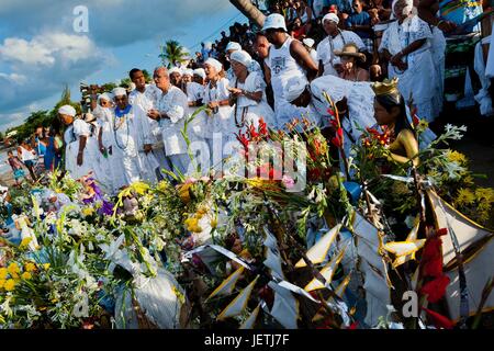 Candomble devotees  dance and sing during the ritual procession in honor to Yemanya, the goddess of the sea, in Amoreiras, Bahia, Brazil, 3 February 2012. Yemanya, originally from the ancient Yoruba mythology, is one of the most popular ‚Orixas, the deit | usage worldwide Stock Photo