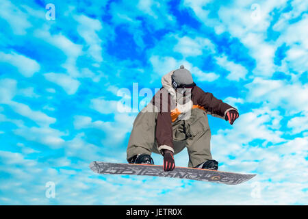 Snowboarder in action, Snowboarder in Aktion Stock Photo