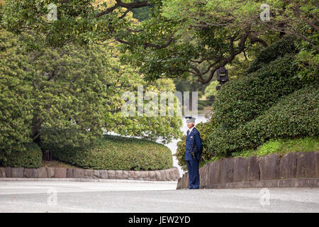 TOKYO, JAPAN - CIRCA APR, 2013: Guard is in the inner ground. Security is in the garden of the Tokyo Imperial Palace. The primary residence of the Emp Stock Photo