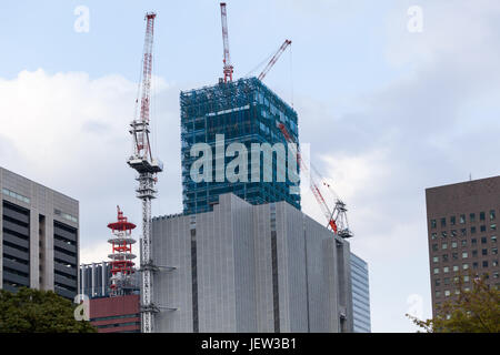 TOKYO, JAPAN - CIRCA APR, 2013: Yomiuri Shimbun Tokyo Headquarters building is under construction. The Marunouchi is a central commercial district of  Stock Photo