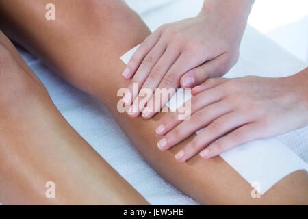 Woman getting her legs waxed Stock Photo
