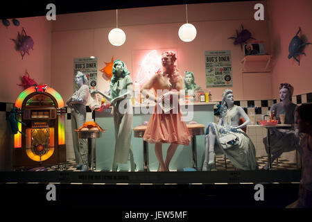 LONDON, ENGLAND - JULY 12, 2016 Fancy clothing on mannequins in a store in London. Stock Photo