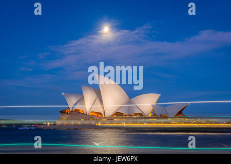 View on Sydney Opera house at night and ferry lights infront, long exposure Stock Photo