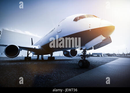 Passenger airplane on the airport parking. Aircraft, airline transportation industry. 3D illustration Stock Photo