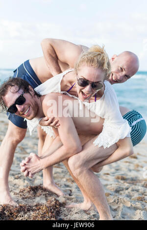 Young people having fun on beach Stock Photo