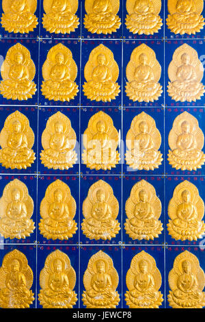 Golden buddha wall tiles located in the Pagoda of Ten Thousand Buddhas at  Kek Lok Si Temple located in Air Itam, Penang, Malaysia. Stock Photo