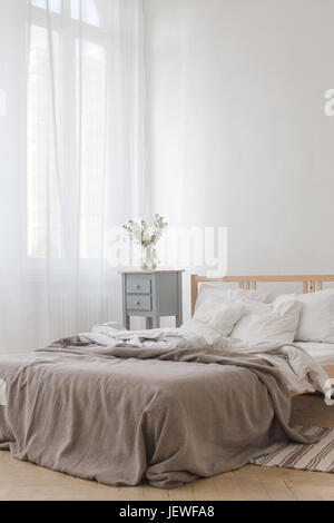 View of an unmade crumpled bed Stock Photo