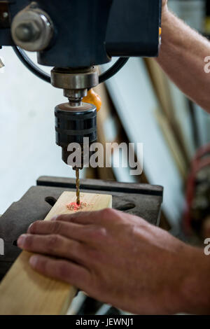 Carpenter using a drill Stock Photo