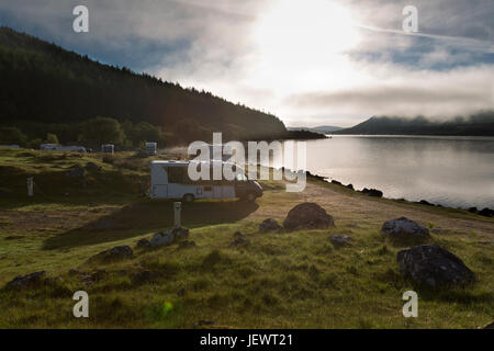 Area of Altnaharra, Scotland. Picturesque sunrise view of the Caravan and Motorhome Club site at Grummore near Altnaharra. Stock Photo