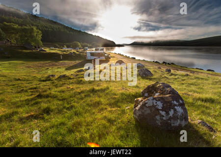 Area of Altnaharra, Scotland. Picturesque sunrise view of the Caravan and Motorhome Club site at Grummore near Altnaharra. Stock Photo