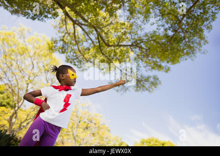 Cute girl pretending to be a superhero Stock Photo