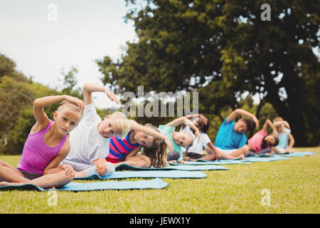 Group of children doing yoga Stock Photo