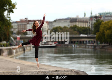 Beautiful ballerina dancing on the street Stock Photo