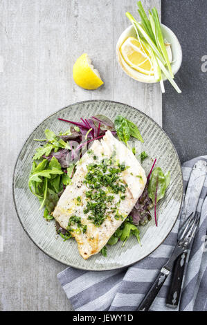 Coalfish Filet with Mixed Salad on Plate Stock Photo