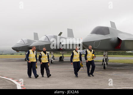 Official Media Assignment RNAS Culdrose, Helston, Cornwall, UK. 27th June, 2017. Four Aircraft Handlers from RNAS Culdrose about to complete their training at RNAS Culdrose dummy deck facility prior to joining HMS Queen Elizabeth. Background four F35B replica jets Credit: Bob Sharples/Alamy Live News Stock Photo