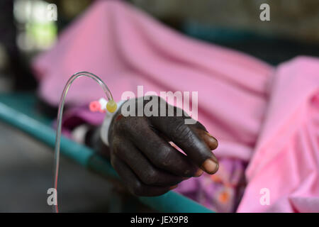 June 28, 2017 - Juba, Jubek, South Sudan - Joyce Auma, 20, lays on bed recovering from a severe case of cholera Wednesday in the General Hospital In Juba, South Sudan, where more than half the population is suffering from a severe humanitarian crisis including near-famine. (Credit Image: © Miguel Juarez Lugo via ZUMA Wire) Stock Photo